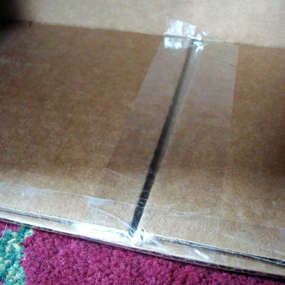 Using packing tape, seal all of the edges and affix the inside flaps into place.