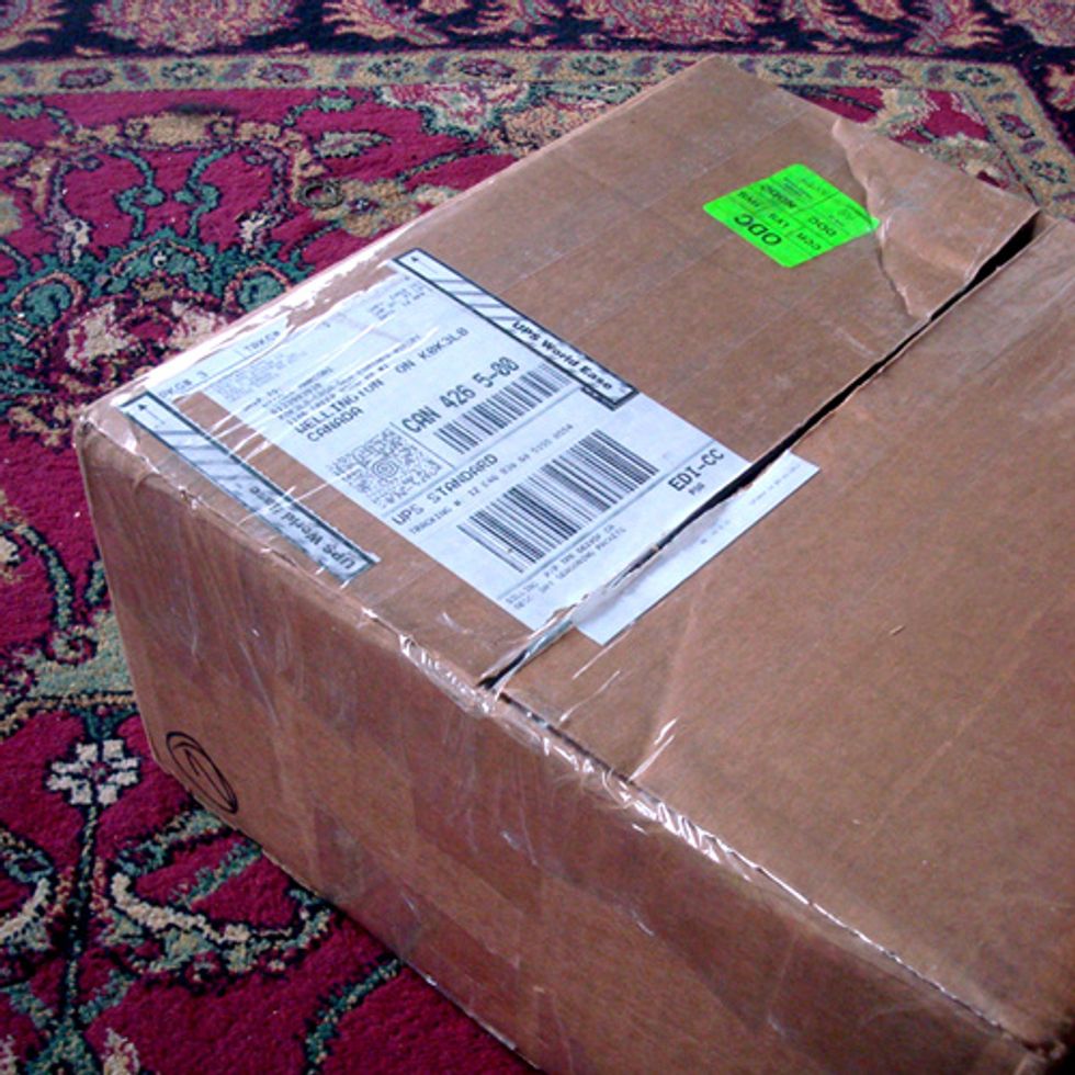 Using packing tape, seal an empty shipping box. I used boxes that my scrapbook paper was shipped in so it was the perfect size.