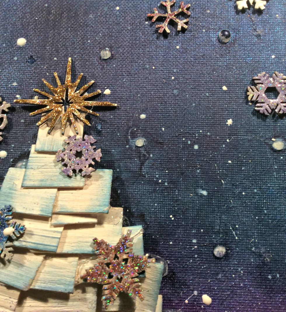 Using paint brush and white paint, splatter all over your canvas. See the little glue dots from the previous project. It's ok because they look like snow. lol
