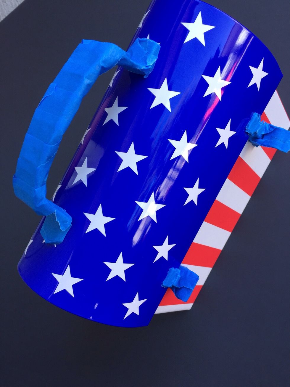 Using painters tape, cover any piece you don't want painted. I covered the handle in this picture, but eventually took the tape off and painted the handle also.