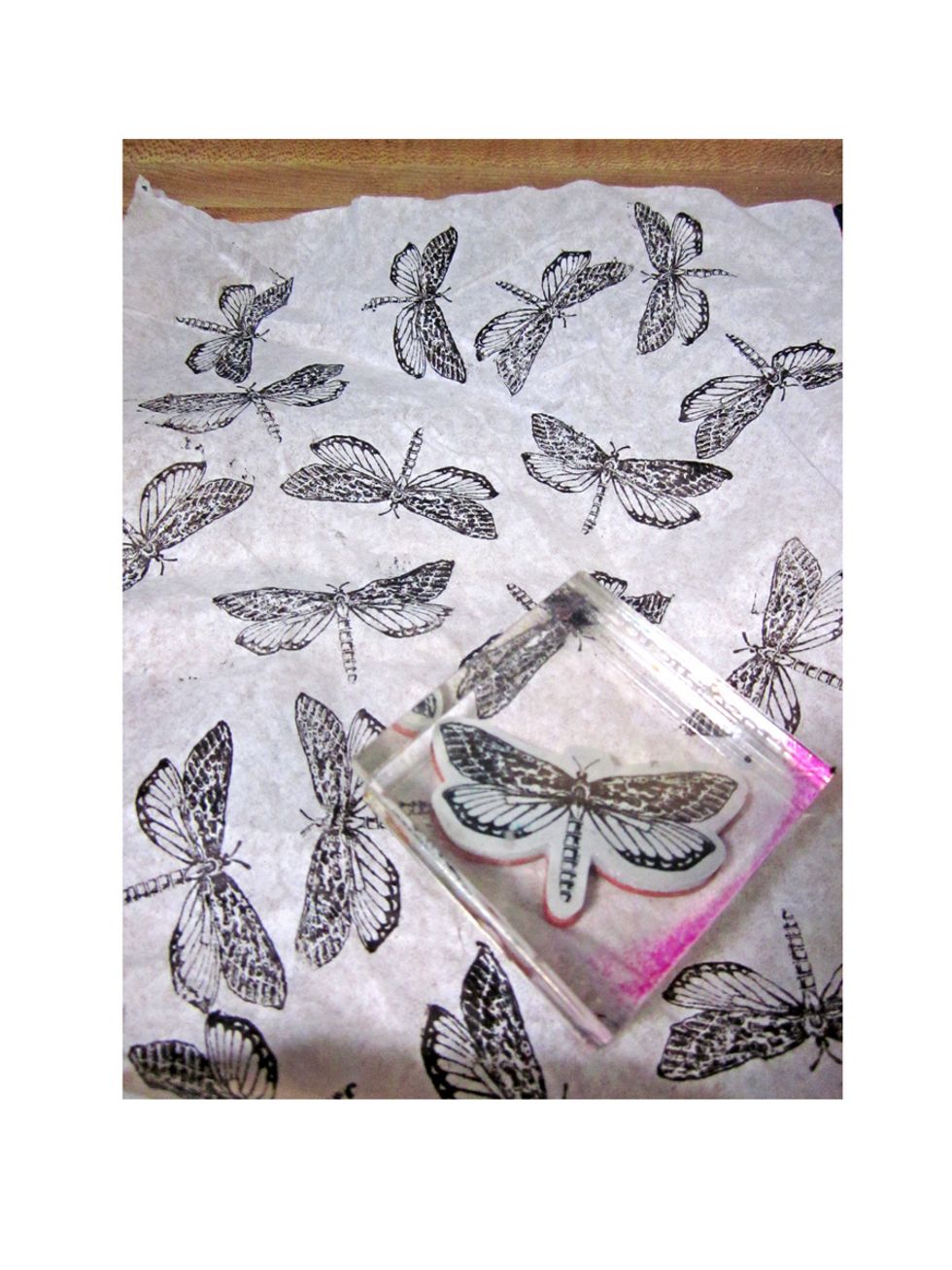 Using plain tissue paper stamp randomly over the tissue paper. I'm using a stamp from the Botanical Tea Graphic 45 collection.