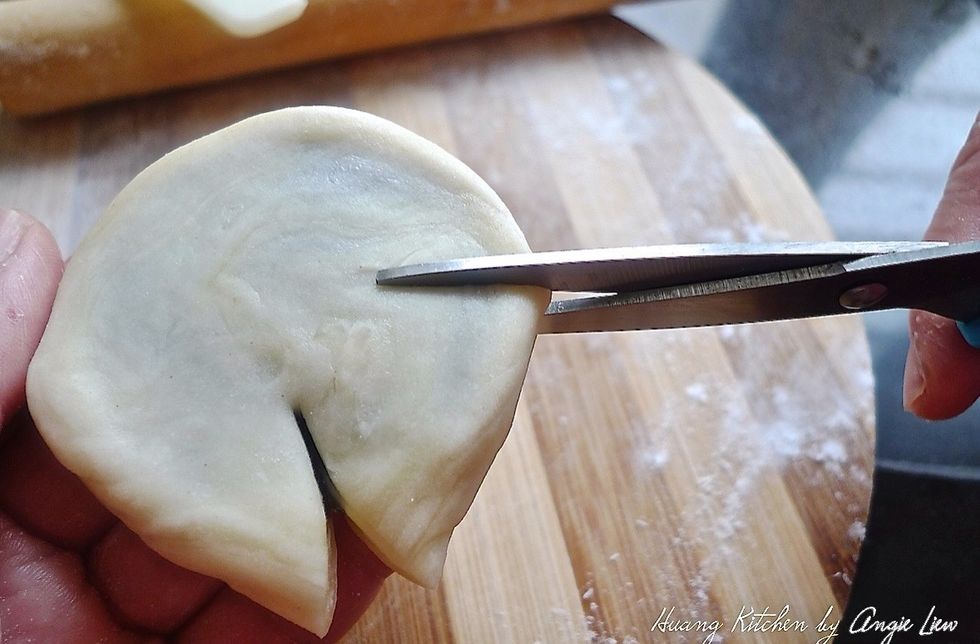 Using scissors, cut "petals" on the dough.