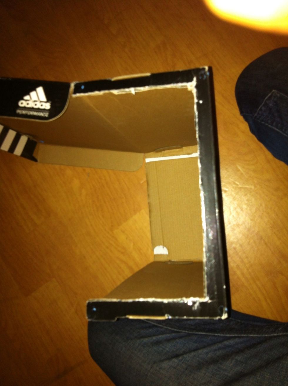 Using scissors cut the cardboard as shown.