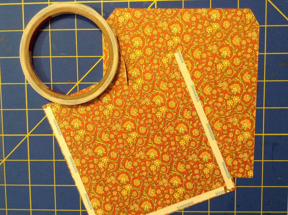 Using Scor-Tape, adhere 2 pieces of patterned paper together, creating a sleeve for the bag. The papers measure 5 1/2 x 5 3/4 (front) and 5 1/2 x 6 1/4 (back)