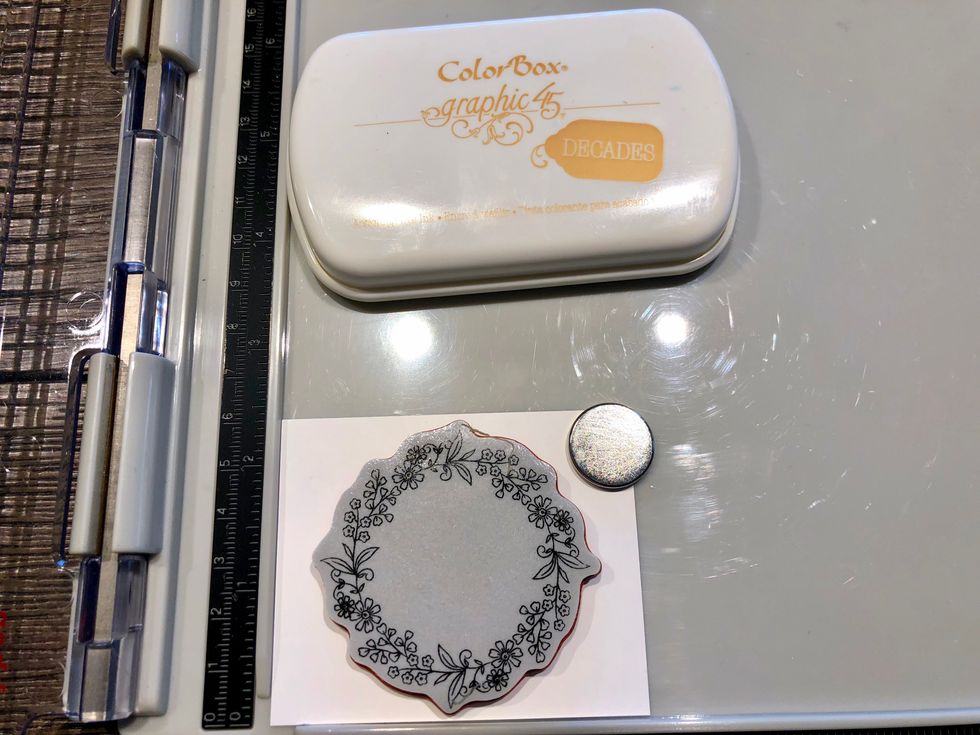Using scrap of white cardstock and stamp the wreath image.