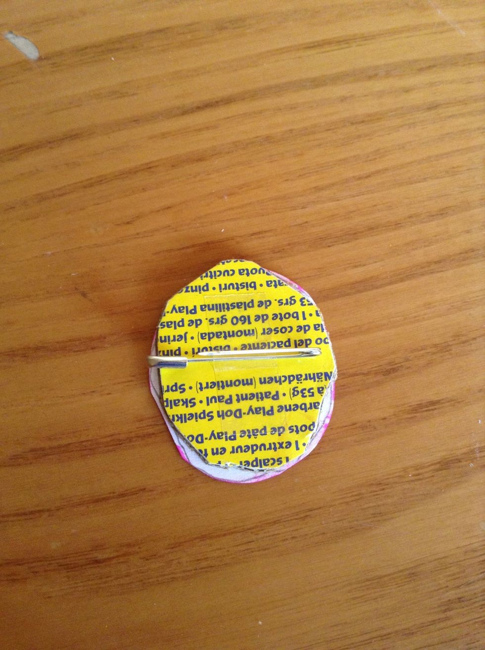 Using Sellotape secure pin to badge
