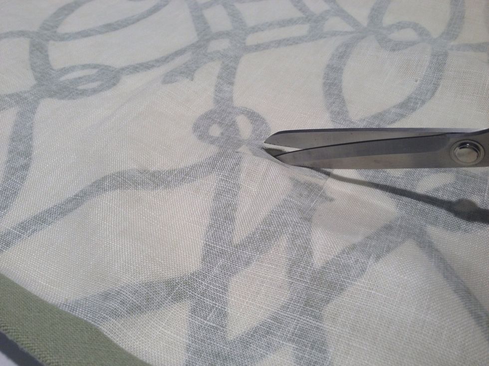 Using sharp scissors, cut a 1-1/2" opening along the marked line.