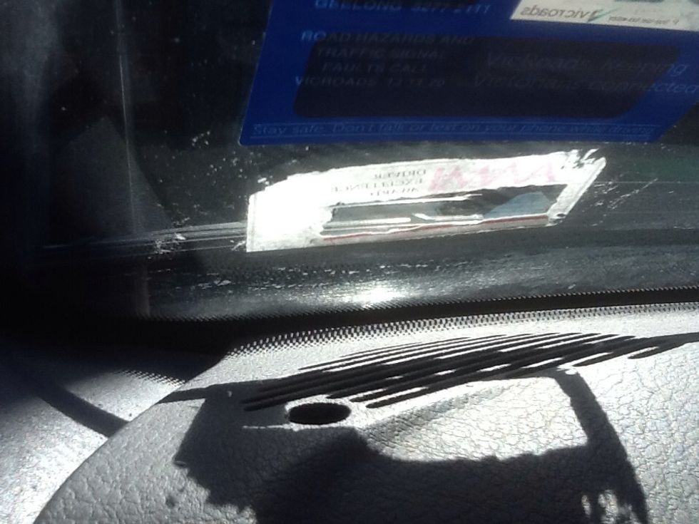 Using slight pressure , you should start to see parts of the sticker falling off