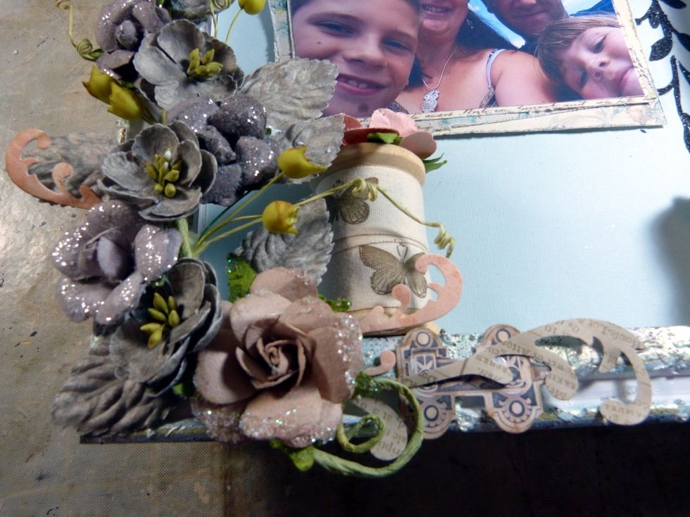 Using some pieces from the Salvage District ephemera from the embellishment add on, ink and poke into the end of the vine cluster.