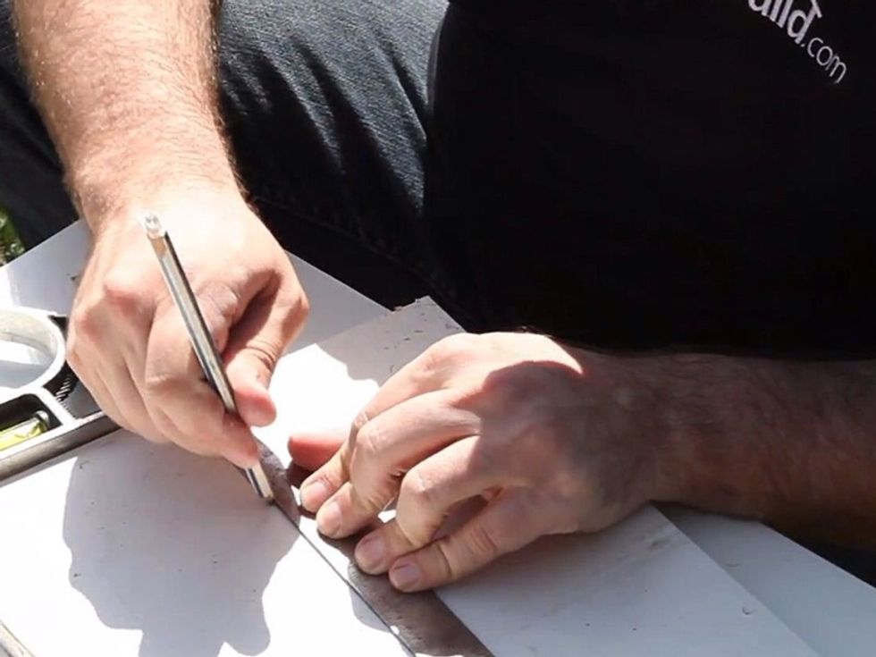 Using some scrap drywall, measure and cut out a drywall replacement piece.