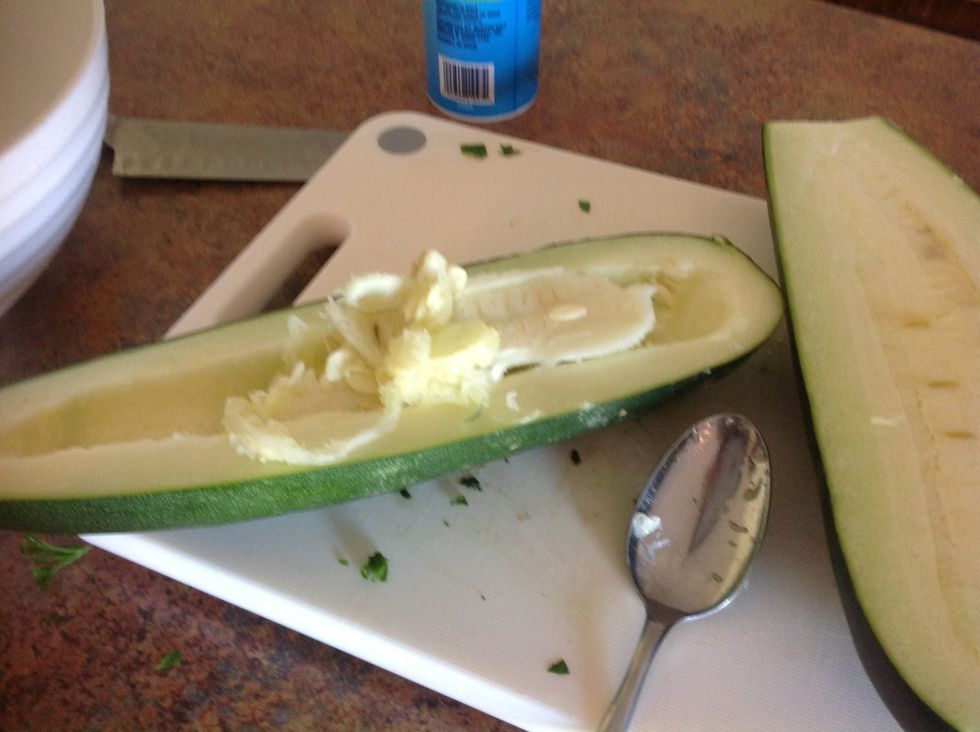 Using spoon scoop out all the seeds.