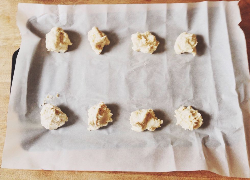 Using spoons or your hands break large ball of dough into smaller pieces and "drop" onto cookie sheet. Bake for 15-17 minutes until tops are slightly golden brown.