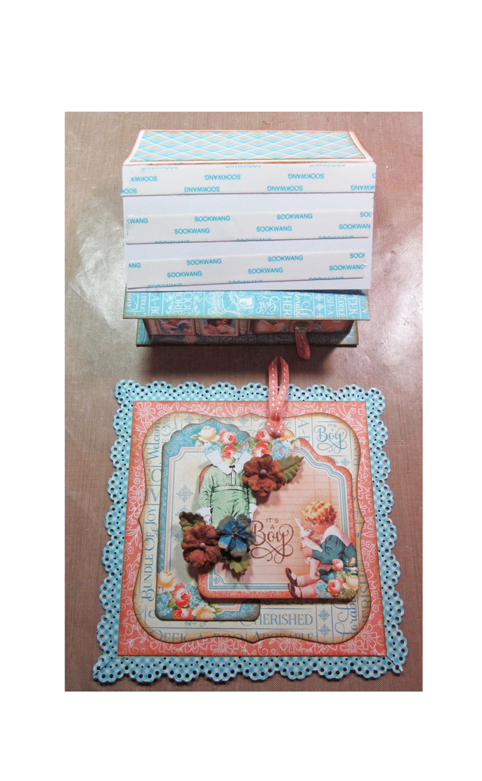 Using strong tape apply glue to the lower half only of of the easel card and attach the decorated front panel.