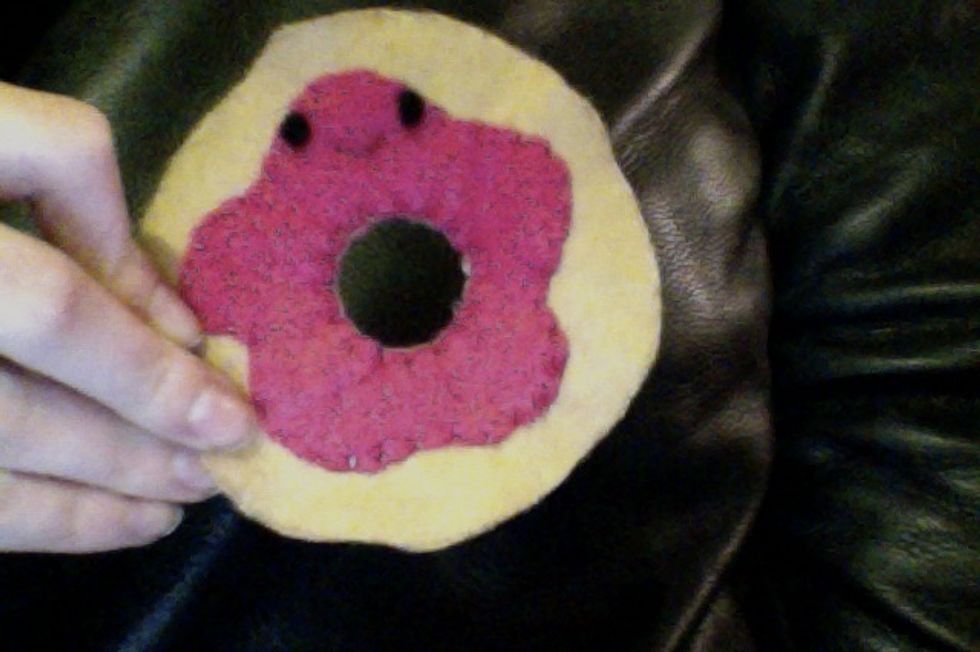 Using tan thread, stitch the front and back together around the inner hole.