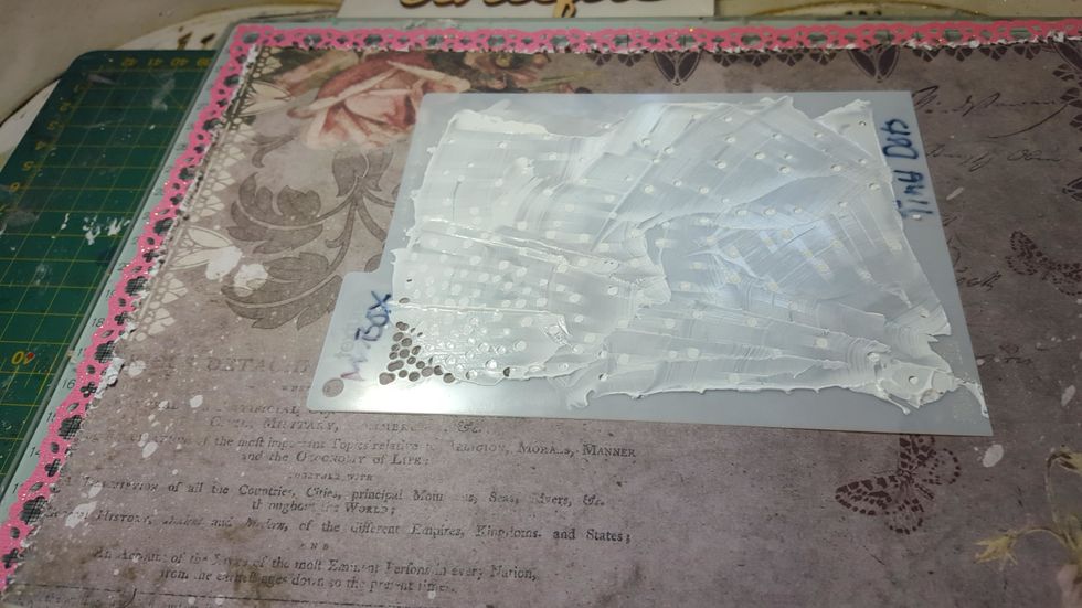 Using texture paste through the mask and add it to the top right and bottom left of the area where the photo and journal cards are going to go.
