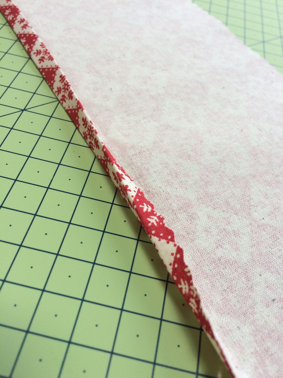 Using the 1/2 inch seam allowance sew a hem along strips forming the pocket tops