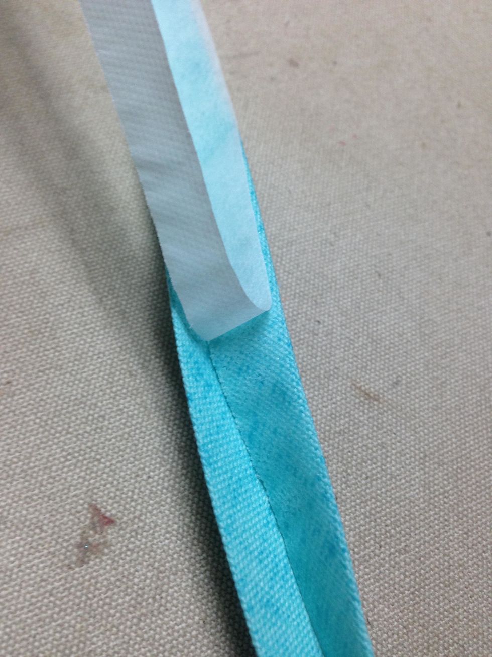 Using the 15\u201dstrips, remove the paper from  the SteamASeam2 applied to both sides of bias banding