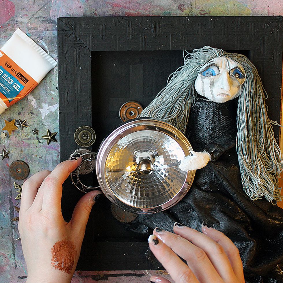 Using the 3D Gel as your adhesive, add more embellishments to the piece. Cluster around the main focal point.