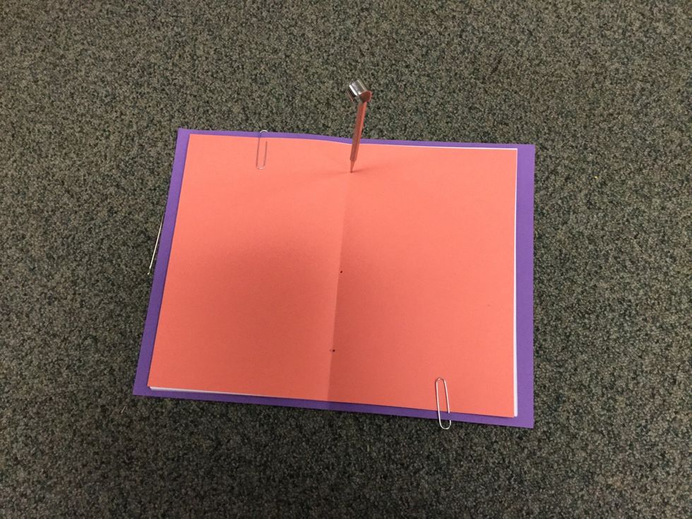 Using the awl make holes where you put the dots