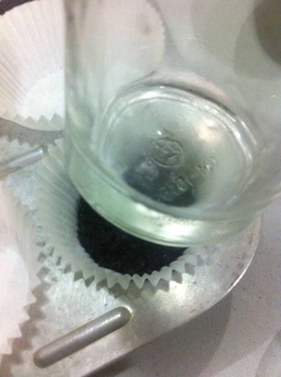 Using the bottom of the glass gently press the crust