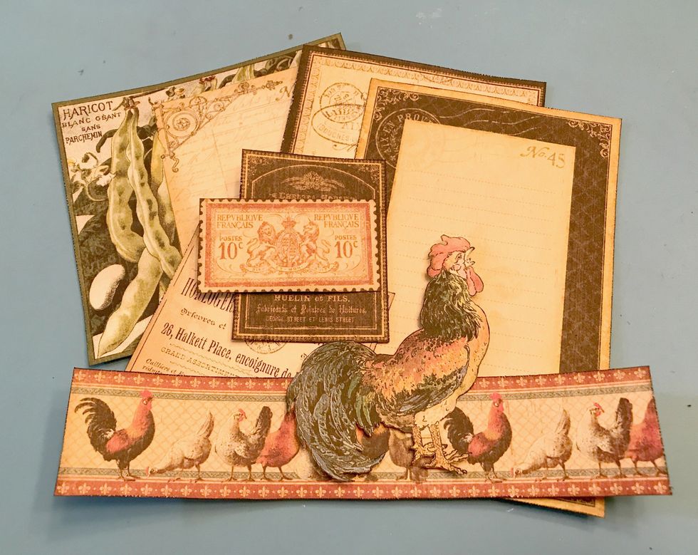Using the card paper, cut 2 - 4x6 cards, pea card, stamp, cream with writing card, black with writing card, rooster & rooster border. Cut border to 7 3/8". Ink edges with Black Ink & Blending Tool.