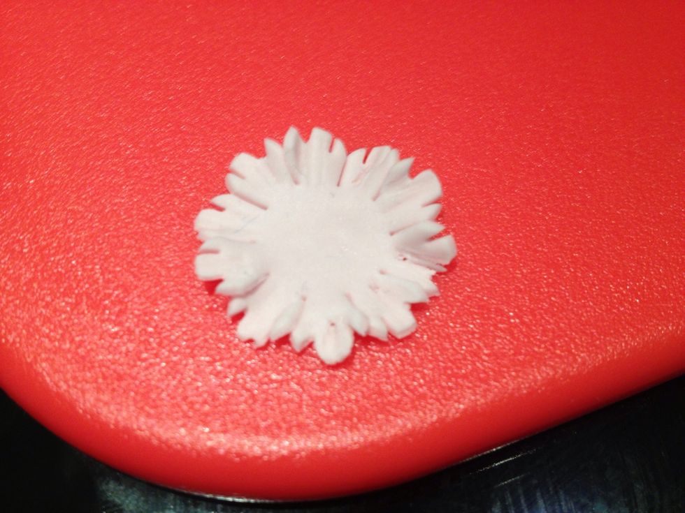 Using the cocktail stick roll up the corners of the other two shapes