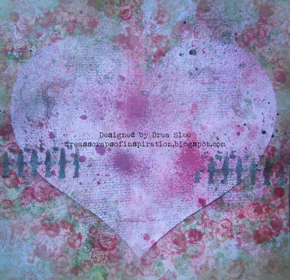 Using the Crafter's Workshop Texturized Stencil, mask the fence design with some black ink. Then add some Ranger Verdigris Embossing Powder to it and heat set with your heating gun.