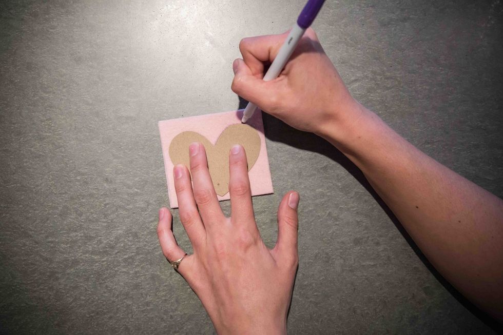 Using the disappearing ink pen, trace around the edge of the heart while making sure the ink is dark enough to see on the felt (especially important on darker colors).