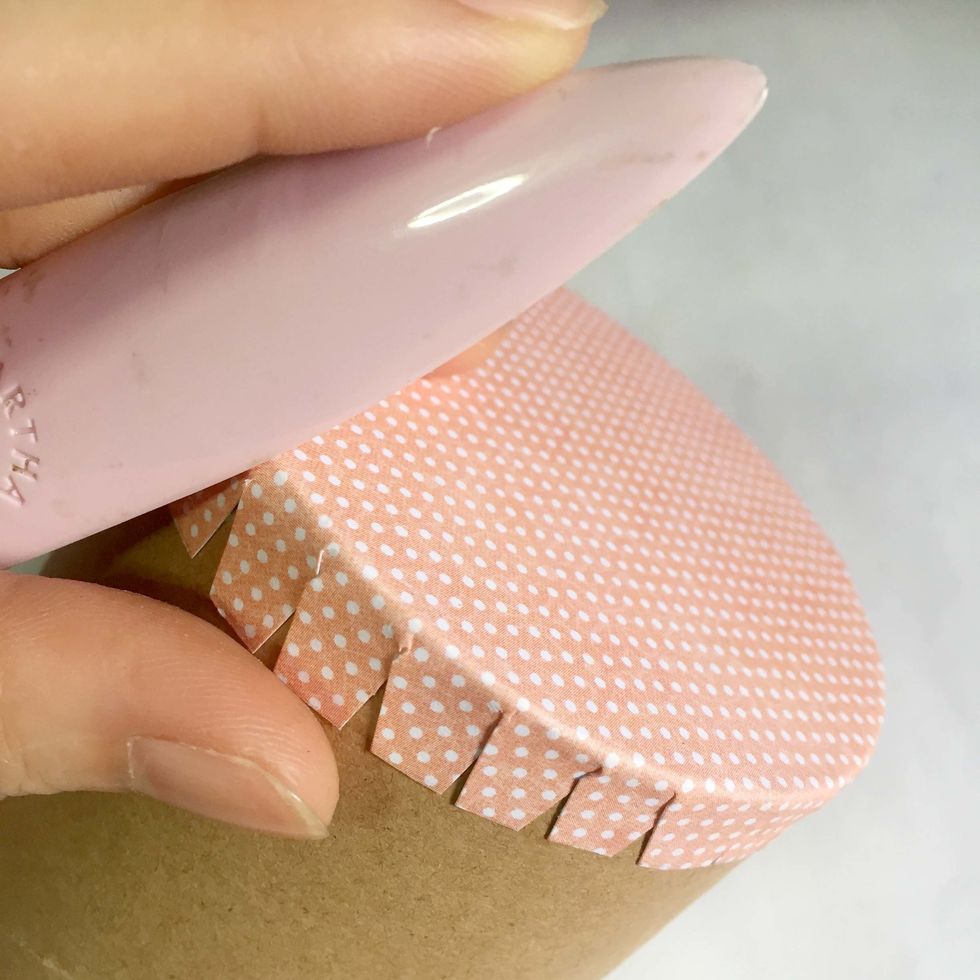 Using the edge of the bone folder, give the edge a good burnish to ensure a smooth surface around the edges.