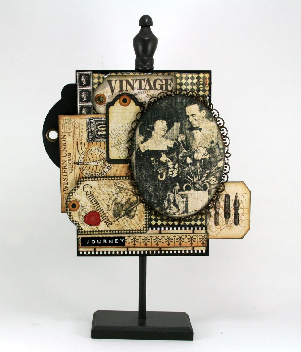 Using the Elegant Ovals Spellbinders die cut frame and add couple image from Communique Society Page. I added Dark Chocolate Liquid Pearls to the scalloped part of the frame.