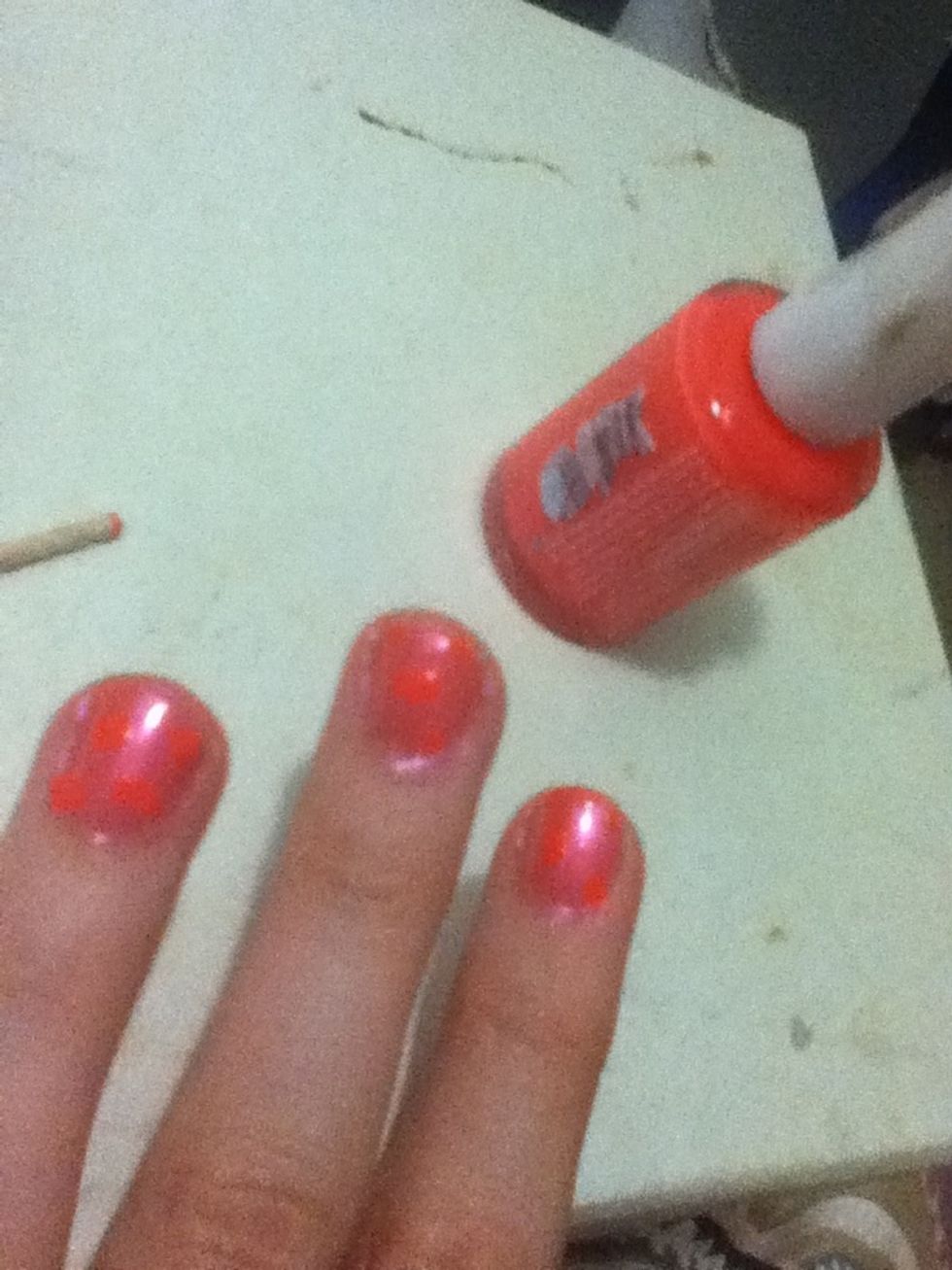 Using the flat end of a toothpick add fluro orange dots. Hint: make them uneven (big and small; lines and dots)