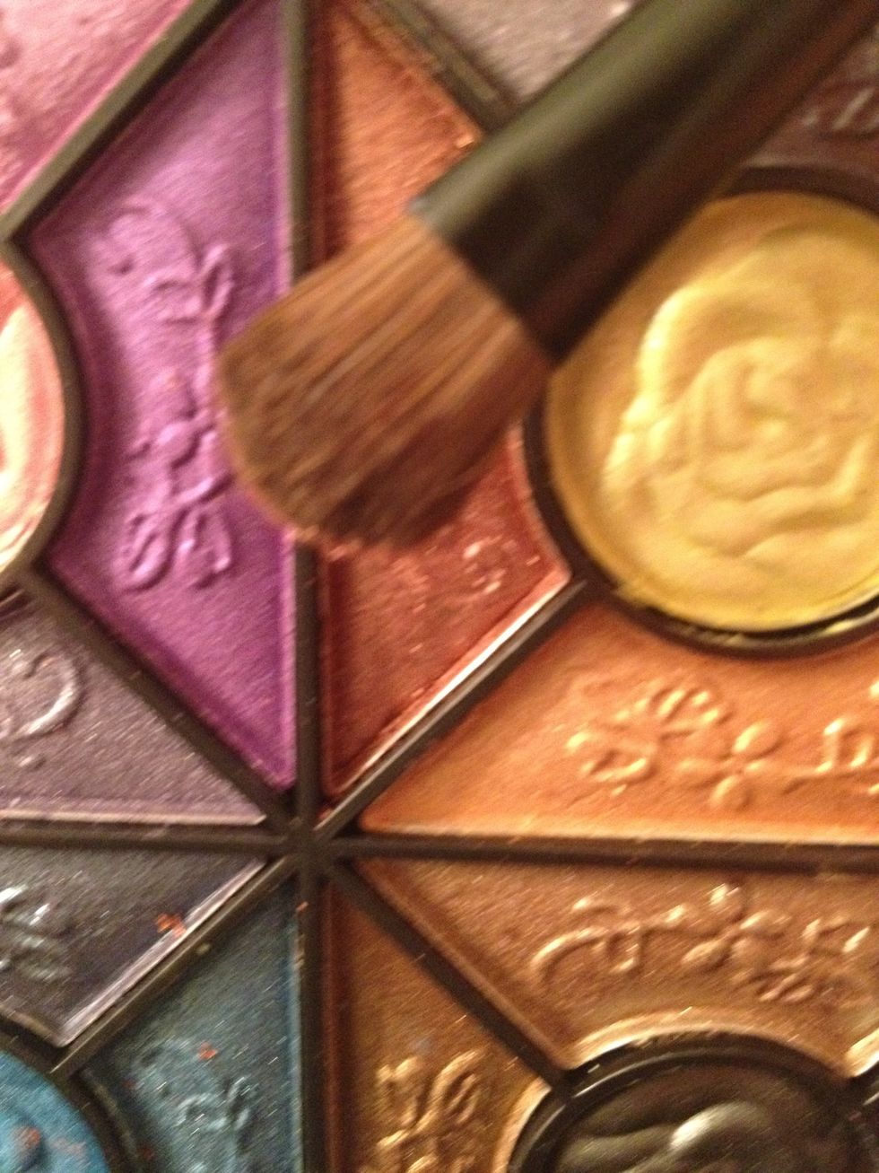 Using the flat eyeshadow brush we are going to take a Bronze eyeshadow and pack it onto our lid *this is a palette(misty armour) I bought from mizoutlet.com