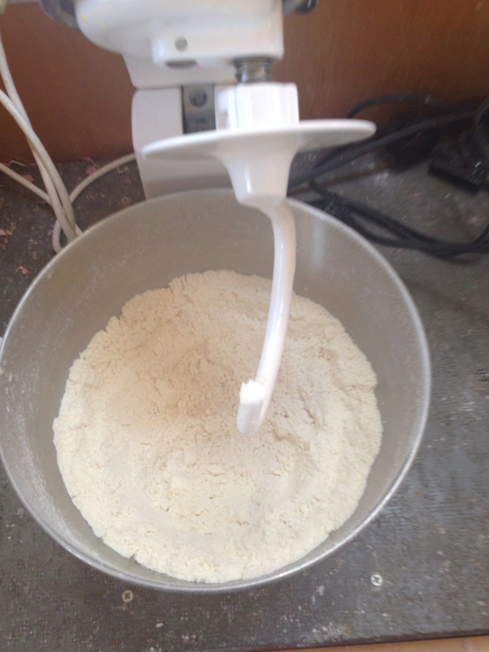Using the hook attachment on the mixer, slowly pour in the milk with the mixer going on medium speed. ***NOTE: you may need more or less milk depending on the baking conditions***