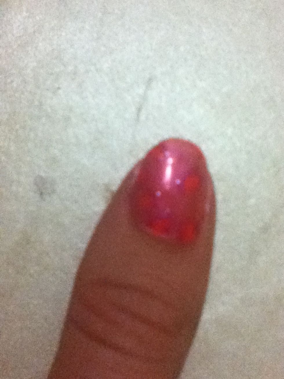 Using the hot pink nail polish, add semicircles around the dots with the pointy tip of the toothpick. A good idea is to search cheetah print on google images and copy that!