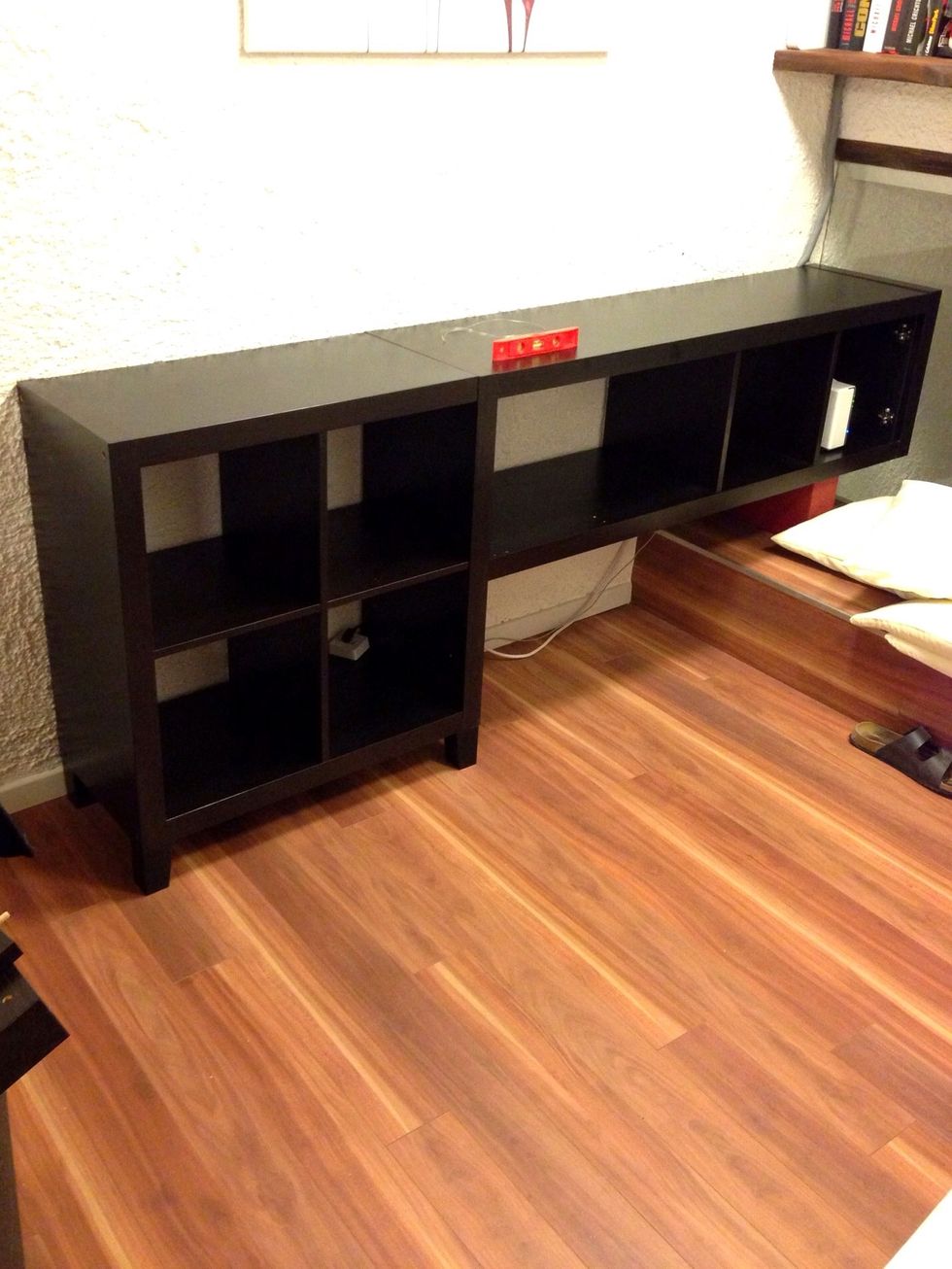 Using the included screws and an L-bracket you can assemble both pieces to one big shelf.