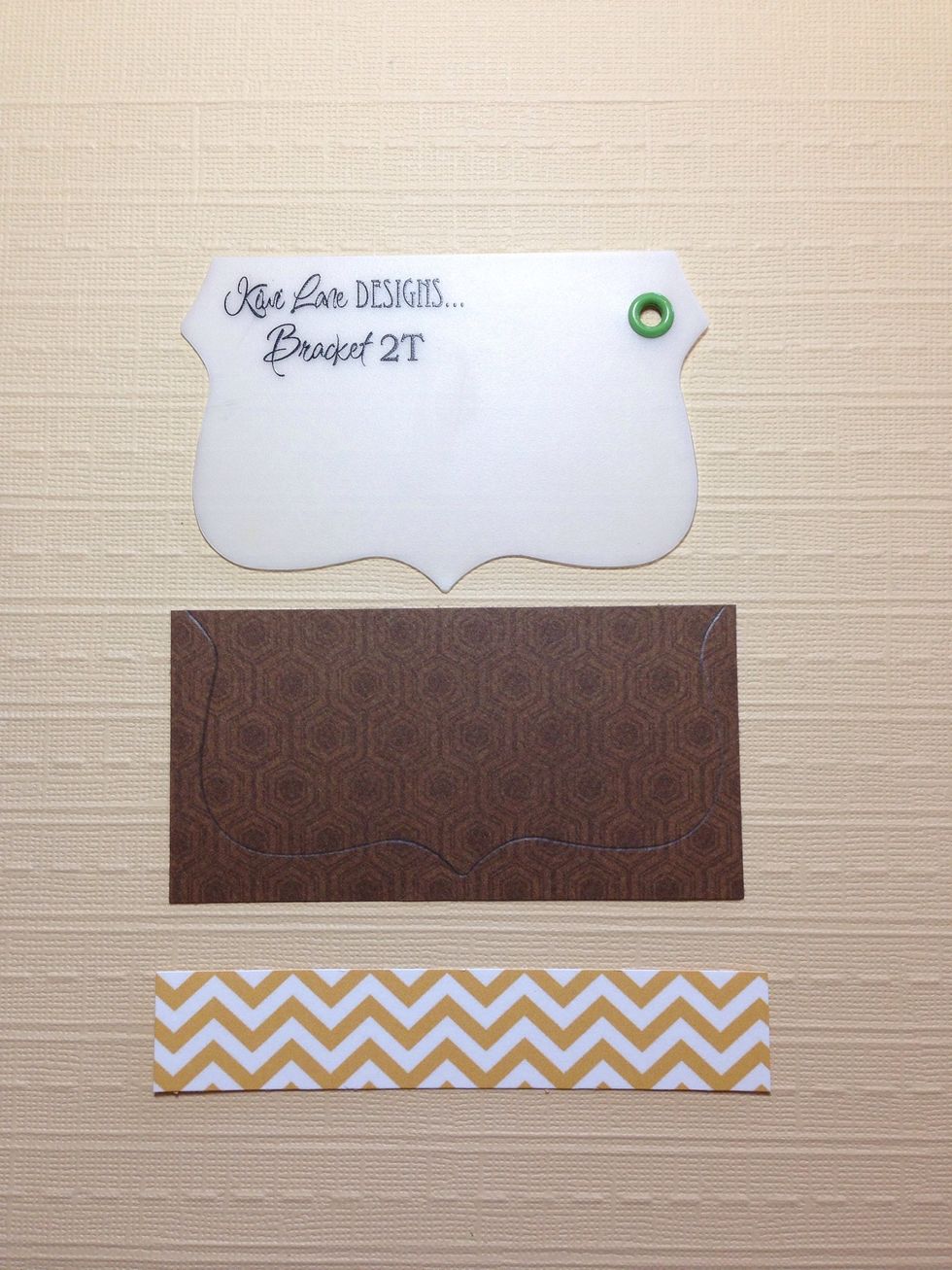 Using the Kiwi Lane Designs 2T template from the Tiny Brackets set, trace the bracket onto a piece of brown cardstock to make the owl face. Also cut a 3/4 x 4 inch strip of pattern paper.