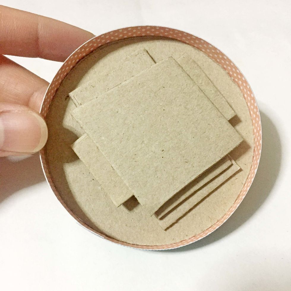 Using the leftover cardboards/chipboards, stack within the inside.