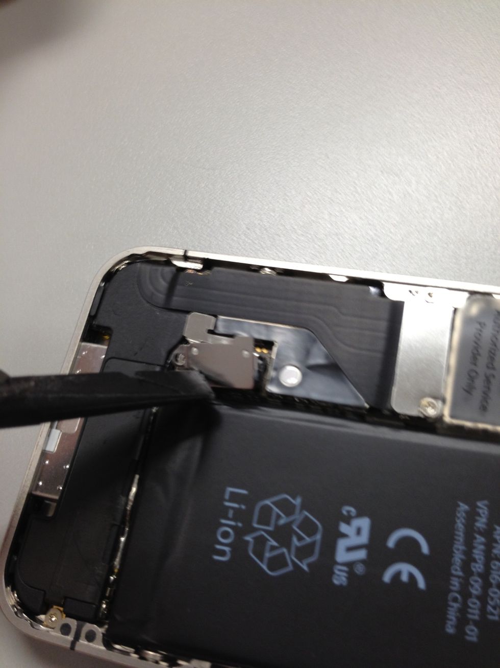 Using the nylon spudger from your tool kit, pull up battery connecter. Slowly. Work the corners a little first. It is extremely important you don't use metal tools when removing connectors.