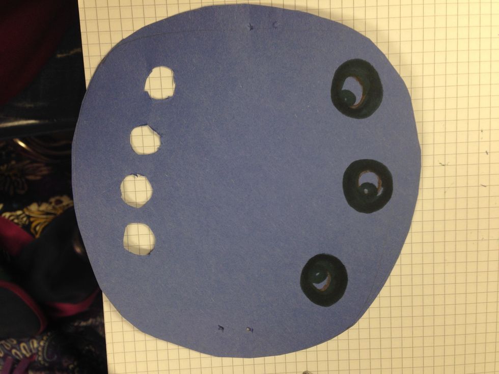 Using the one each punch, punch four holes at bottom. Some of the holes you may need to double punch a little off set to make hole a bit bigger... depending on size of child's fingers.