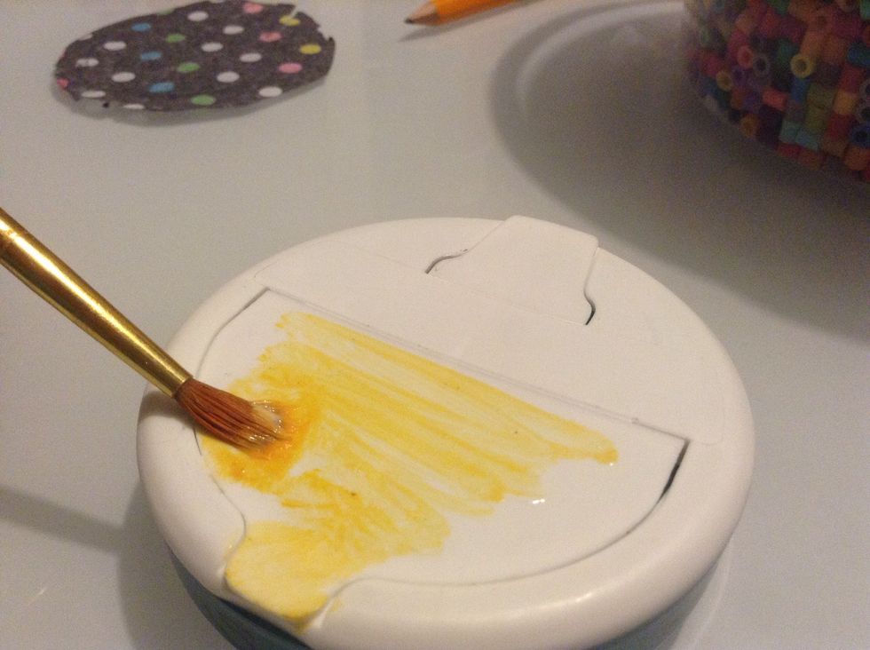 Using the paint brush, apply the mod podge to the top of the box, since I am using a darker color paper, it doesn't matter that my paintbrush was not so clean.