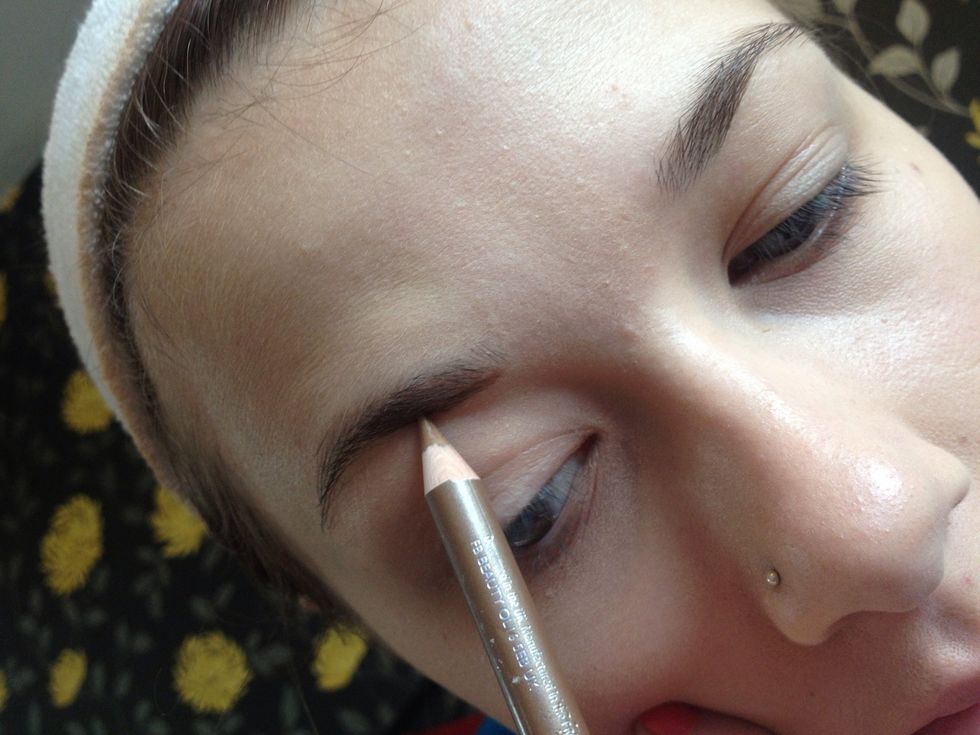 Using the pencil lightly create a line under the underneath of the brow