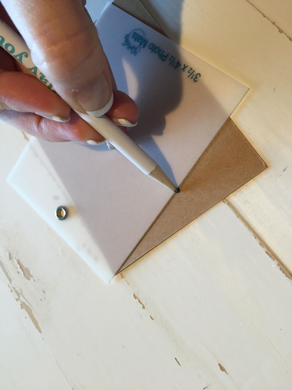 Using the Photo Template as a guide for a line, or you can use a ruler, trace from the top corners down to the middle.