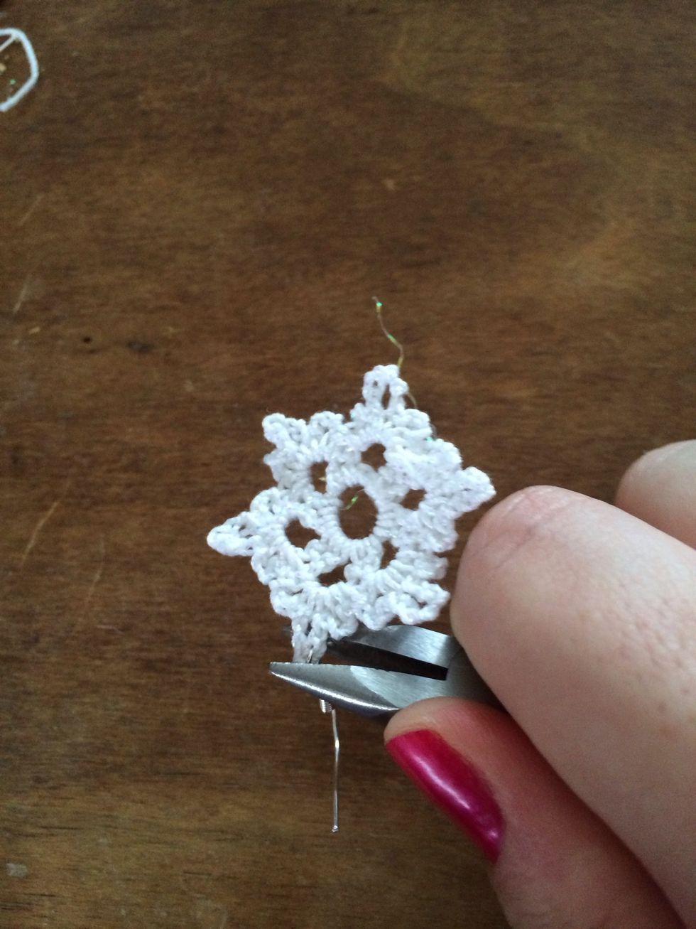 Using the pliers, close the loop if the fishhook earring.