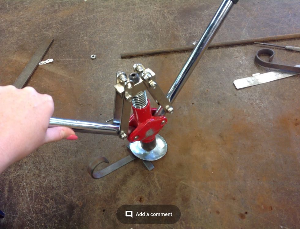 Using the pot rivet gun, place it on the pot rivet. Then pull the gun apart the together, apart and together, then pull up and it should be all finished.