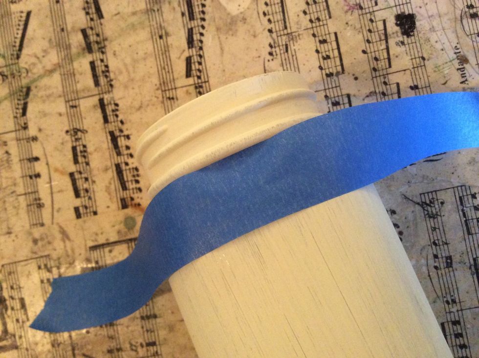 Using the rim of the jar as a guide, wrap the strip of painter's tape around the jar.