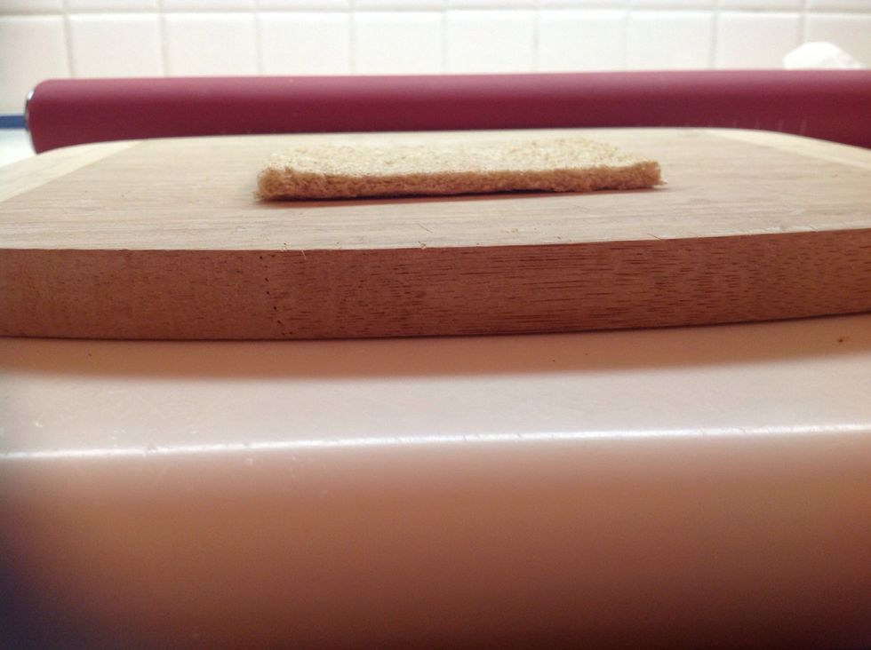 Using the rolling pin flatten the bread until it's nice and thin.