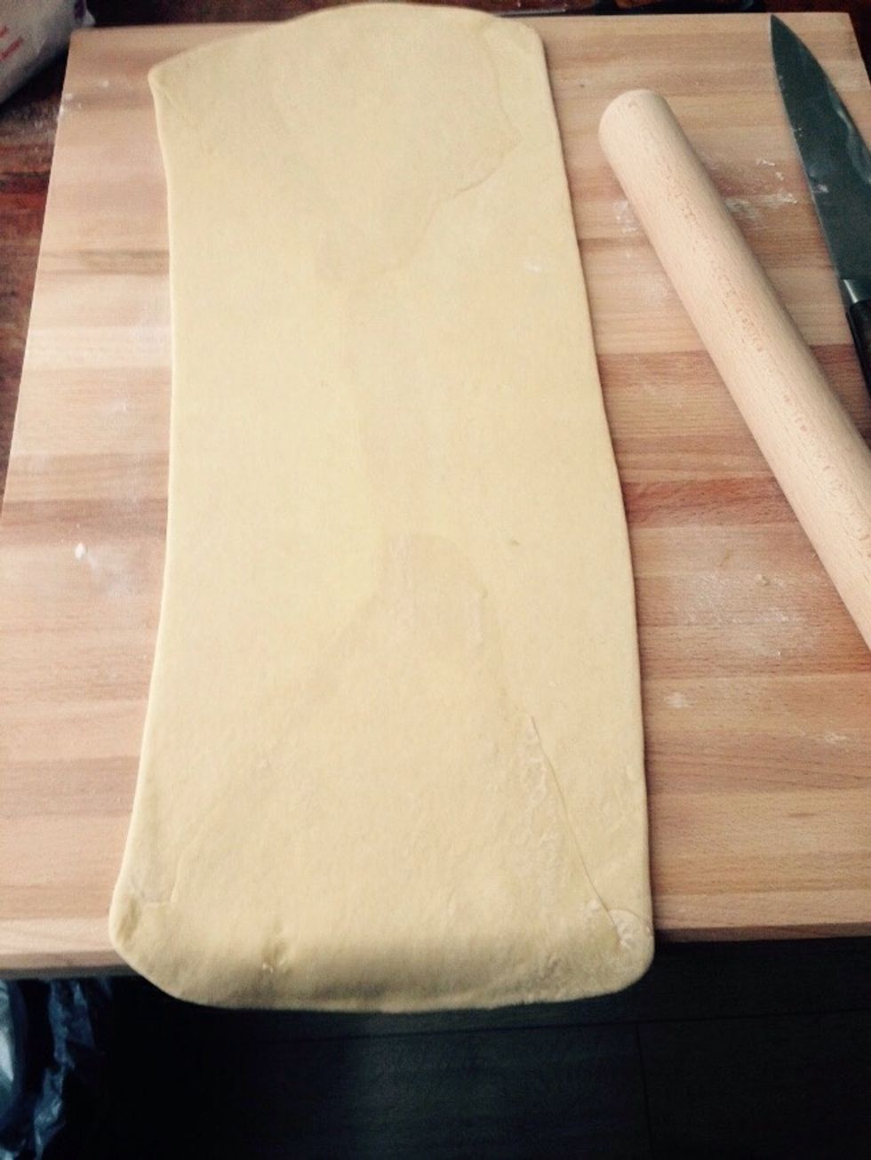 Using the rolling pin lengthen it by 3 times (about 20cm by 60cm)