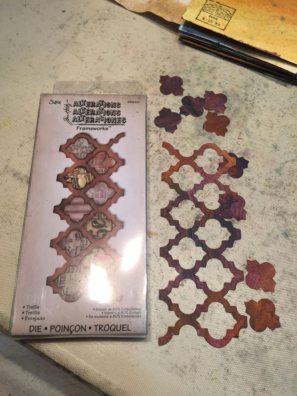 Using the Sizzix Trellis die, cut out the paper you just painted plus a piece of paper from the Tim Holtz Lost and Found paper pad. Save all pieces.