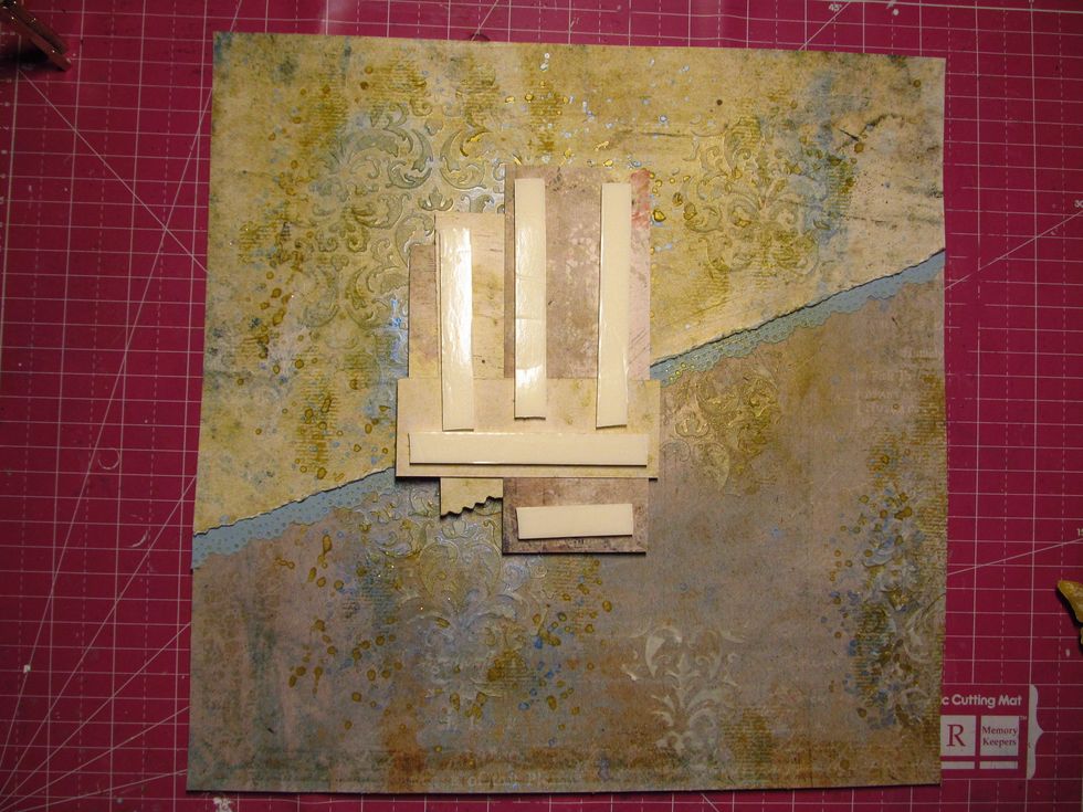 Using the the other half of the ripped paper, build layers behind your photo. Once done, use foam tape (or cardboard) to pop your photo up of the page.