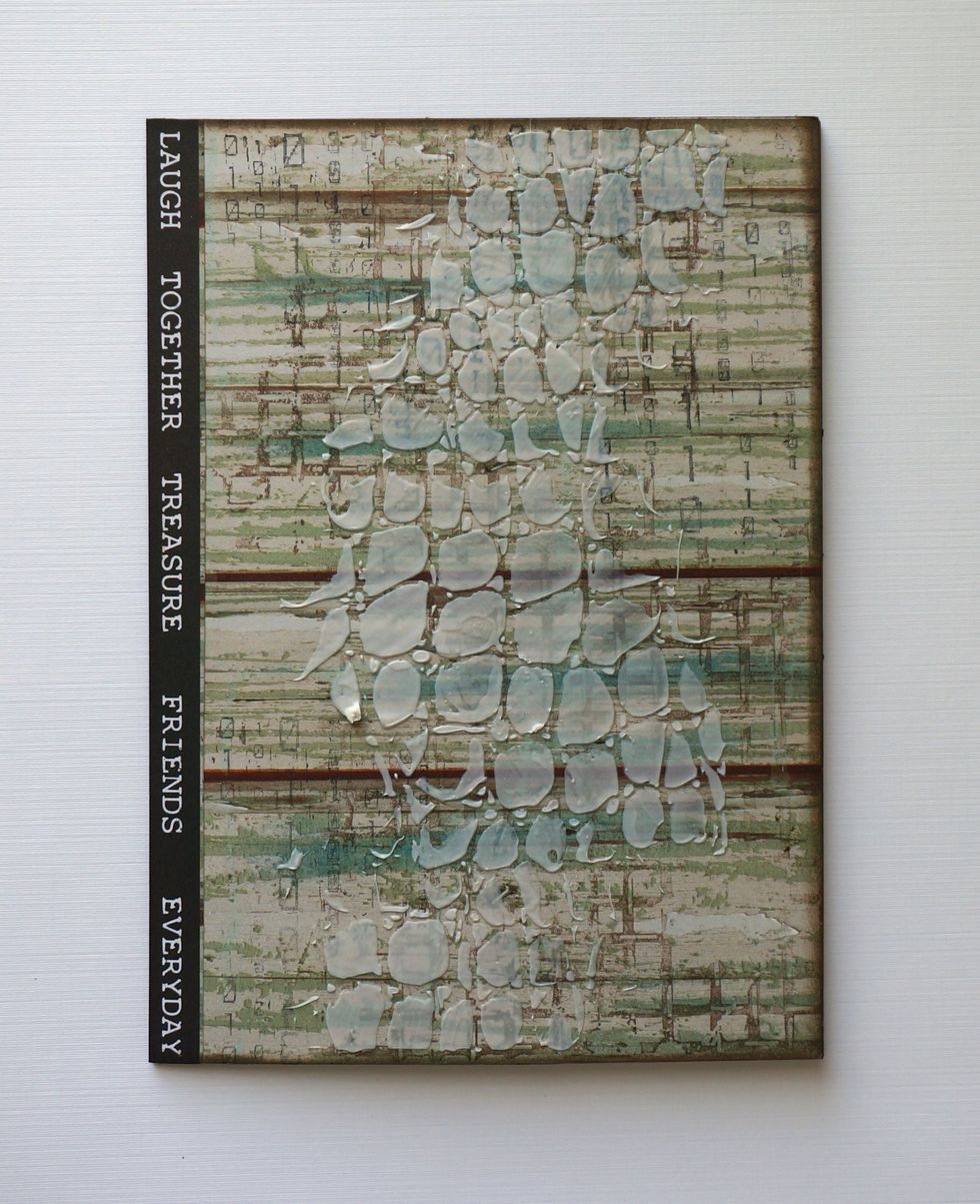 Using the Tim Holtz Crocodile stencil from the kit and some molding paste, I added a bit of texture to my card front!